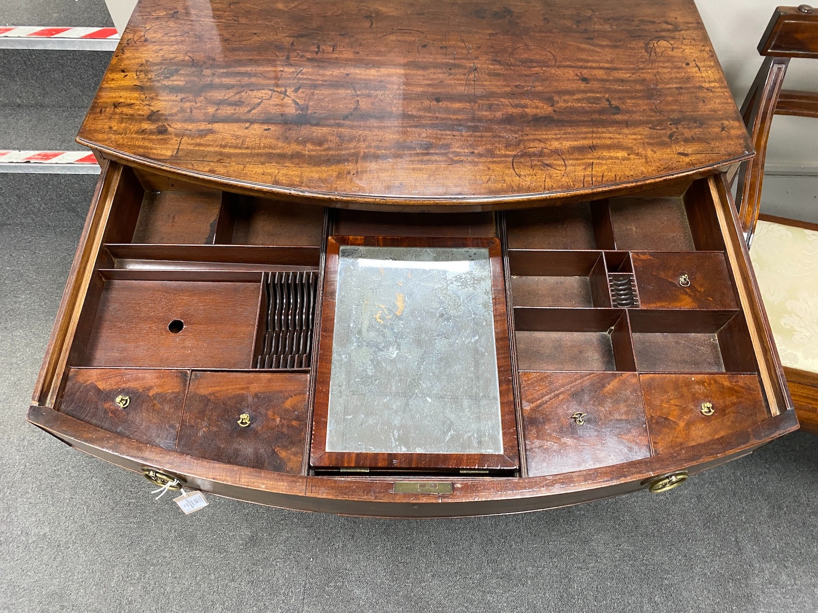 A George III mahogany bowfront dressing chest, with fitted interior, width 106cm, depth 61cm, height 85cm